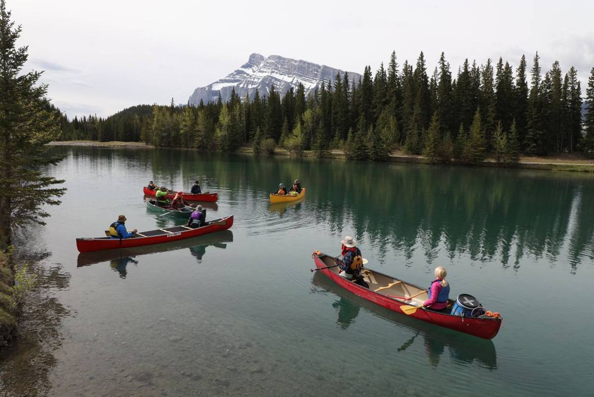 Red canoes on calm water