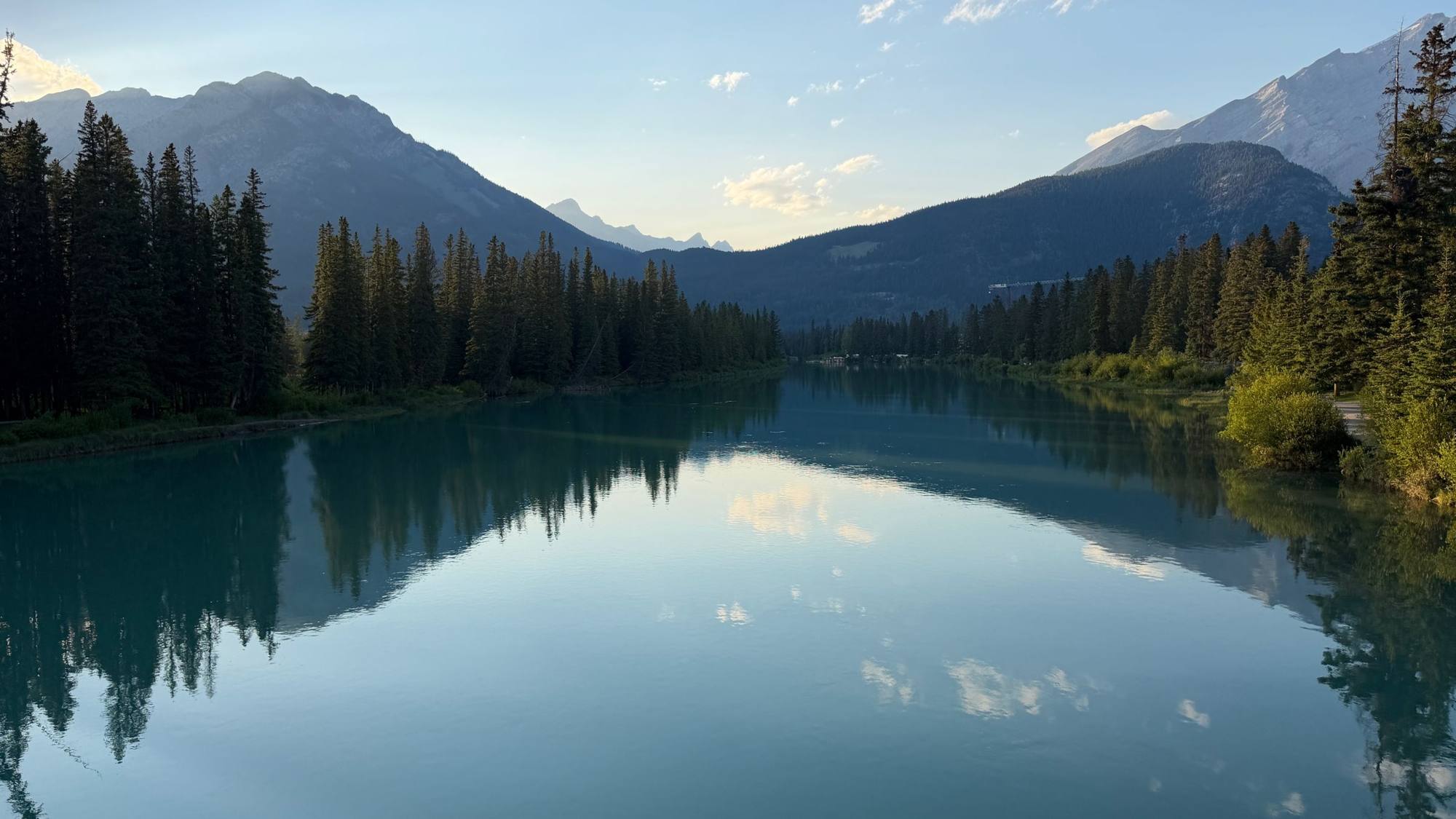 Mountains reflected in a still river